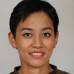 Joyful asian young-adult female with short  black hair and brown eyes