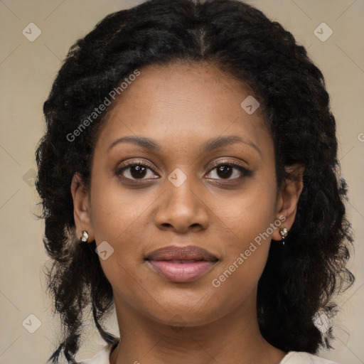 Joyful black young-adult female with long  brown hair and brown eyes