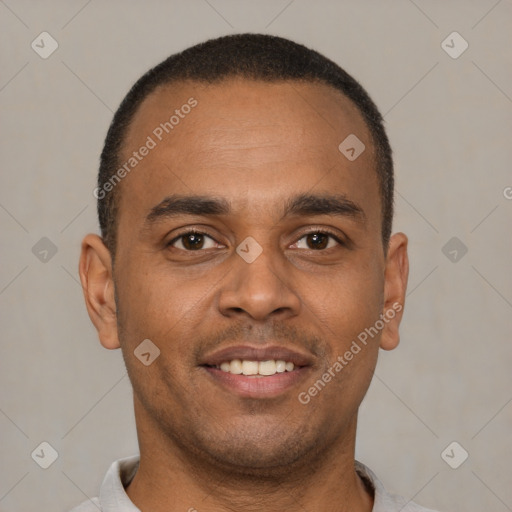 Joyful latino young-adult male with short  brown hair and brown eyes