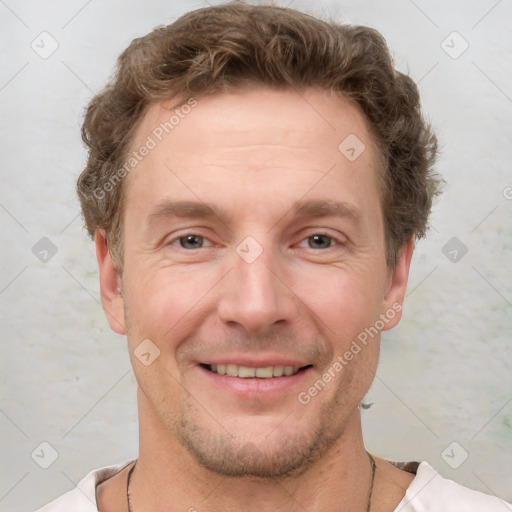 Joyful white adult male with short  brown hair and grey eyes