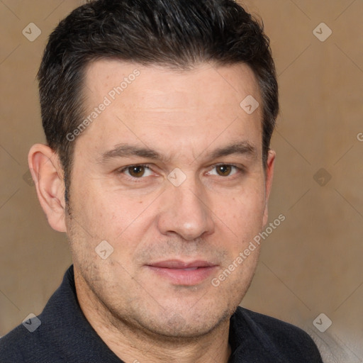 Joyful white adult male with short  brown hair and brown eyes