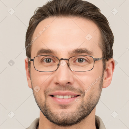 Joyful white adult male with short  brown hair and brown eyes