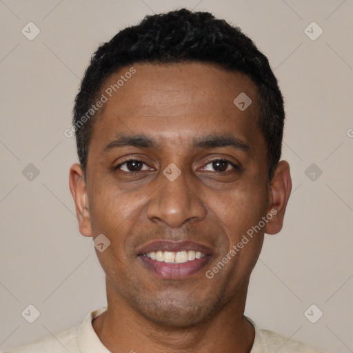 Joyful black young-adult male with short  black hair and brown eyes