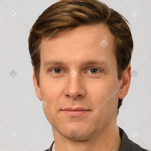 Joyful white adult male with short  brown hair and grey eyes