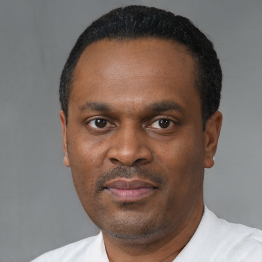 Neutral black adult male with short  black hair and brown eyes