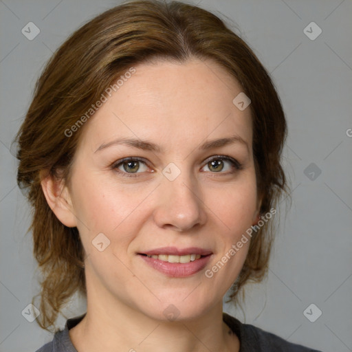 Joyful white adult female with medium  brown hair and grey eyes