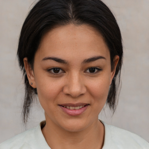 Joyful asian young-adult female with medium  brown hair and brown eyes