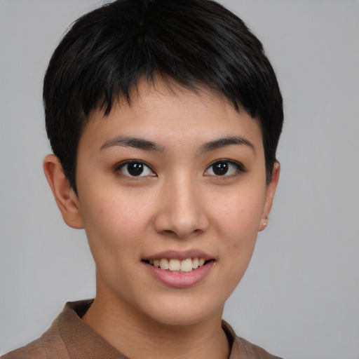 Joyful asian young-adult female with short  brown hair and brown eyes