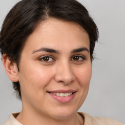 Joyful white young-adult female with medium  brown hair and brown eyes