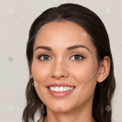 Joyful white young-adult female with long  brown hair and brown eyes