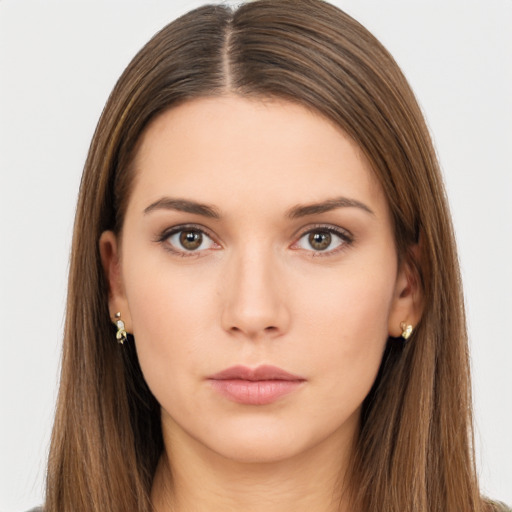 Neutral white young-adult female with long  brown hair and brown eyes