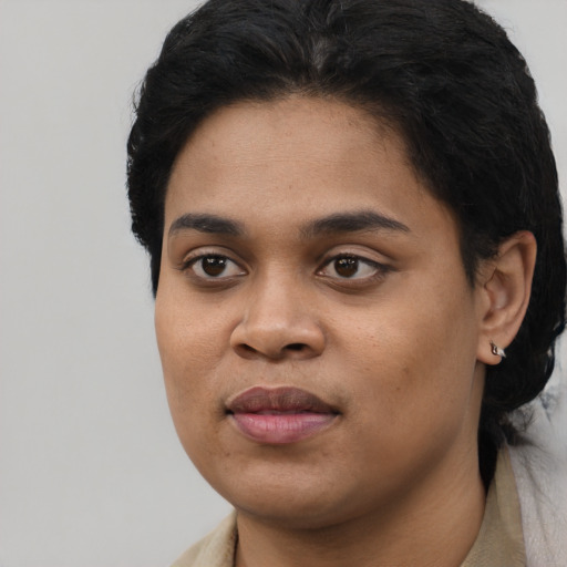 Joyful asian young-adult female with short  black hair and brown eyes
