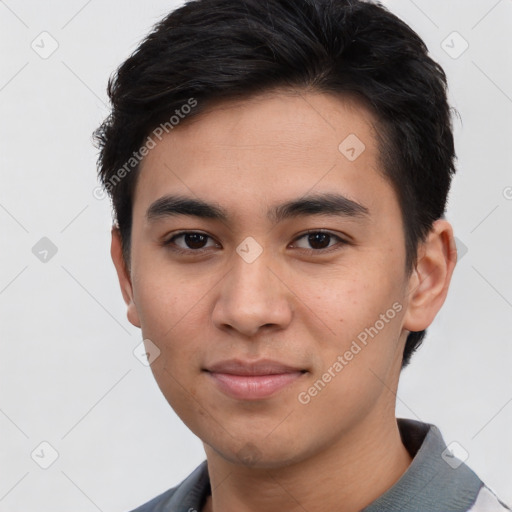 Joyful asian young-adult male with short  brown hair and brown eyes