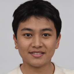 Joyful asian young-adult male with short  black hair and brown eyes