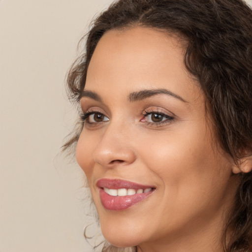 Joyful white young-adult female with medium  brown hair and brown eyes