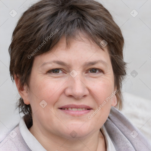 Joyful white adult female with medium  brown hair and blue eyes