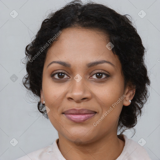 Joyful black adult female with medium  brown hair and brown eyes