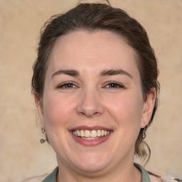 Joyful white adult female with medium  brown hair and brown eyes