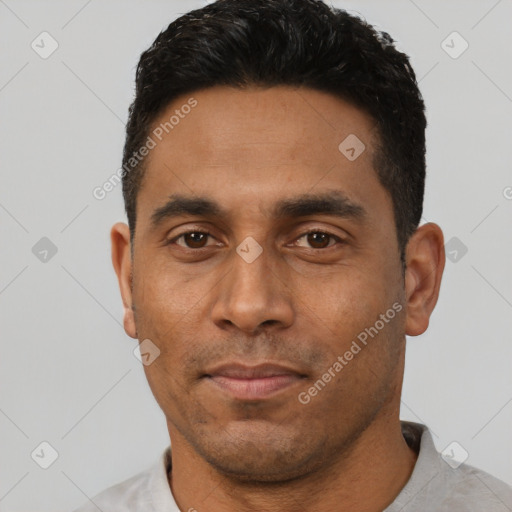 Neutral latino adult male with short  black hair and brown eyes