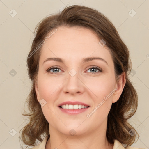 Joyful white young-adult female with medium  brown hair and green eyes