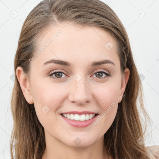 Joyful white young-adult female with long  brown hair and blue eyes