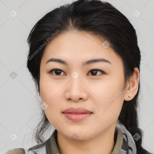 Joyful asian young-adult female with medium  black hair and brown eyes