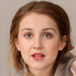 Joyful white young-adult female with medium  brown hair and green eyes