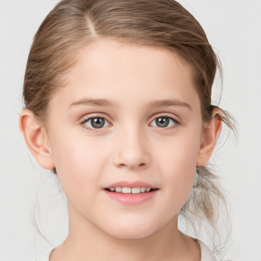 Joyful white child female with medium  brown hair and grey eyes