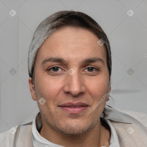 Joyful white adult male with short  brown hair and brown eyes