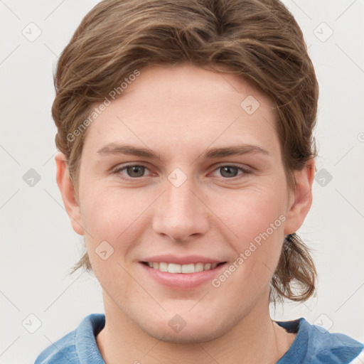 Joyful white young-adult female with short  brown hair and grey eyes