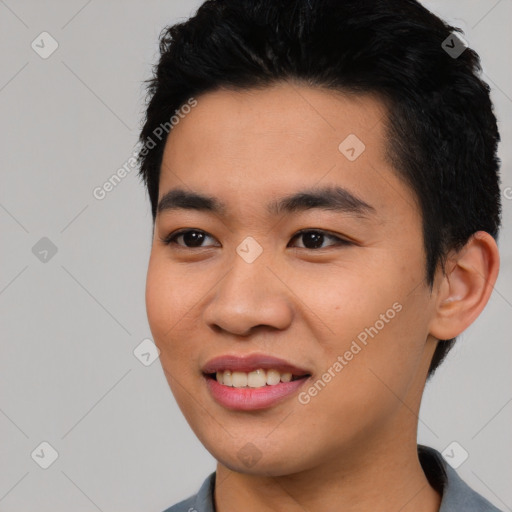 Joyful asian young-adult male with short  black hair and brown eyes