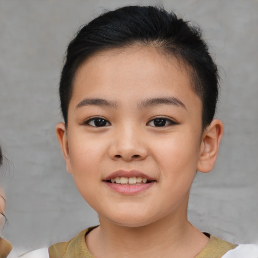 Joyful asian child female with short  brown hair and brown eyes