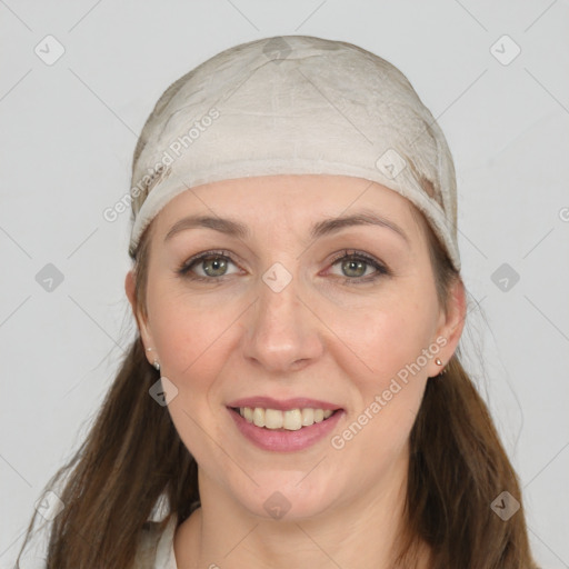 Joyful white young-adult female with long  brown hair and grey eyes