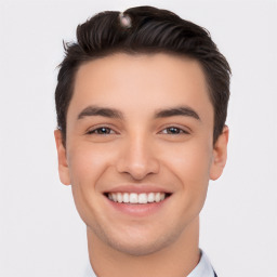 Joyful white young-adult male with short  black hair and brown eyes