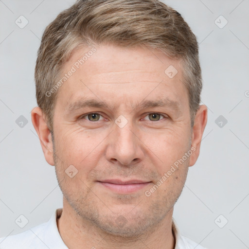 Joyful white adult male with short  brown hair and grey eyes