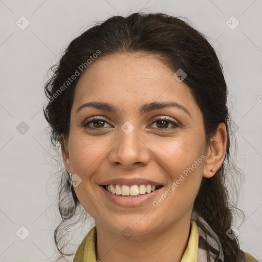 Joyful latino young-adult female with medium  brown hair and brown eyes