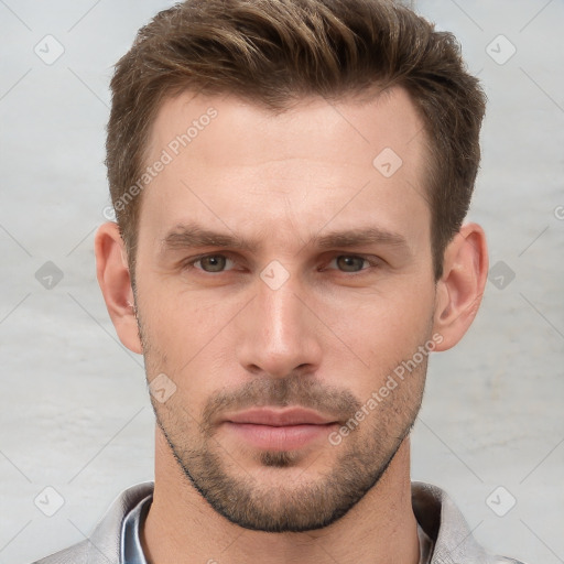 Neutral white young-adult male with short  brown hair and grey eyes