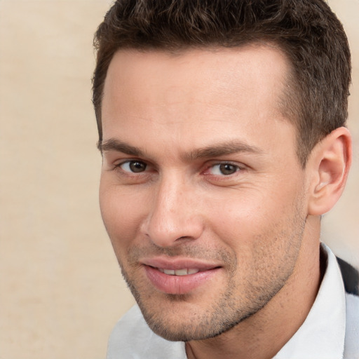 Joyful white young-adult male with short  brown hair and brown eyes