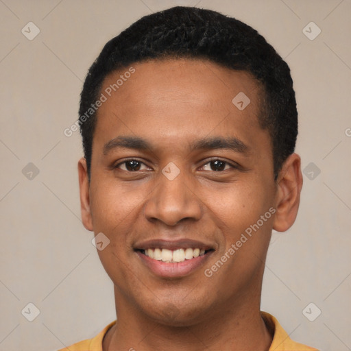 Joyful black young-adult male with short  black hair and brown eyes