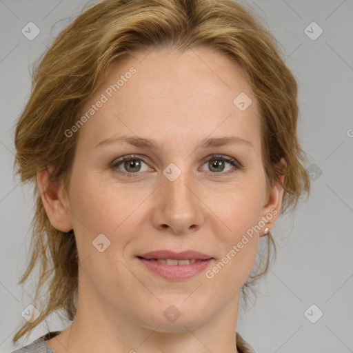 Joyful white adult female with medium  brown hair and green eyes