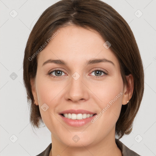 Joyful white young-adult female with medium  brown hair and grey eyes