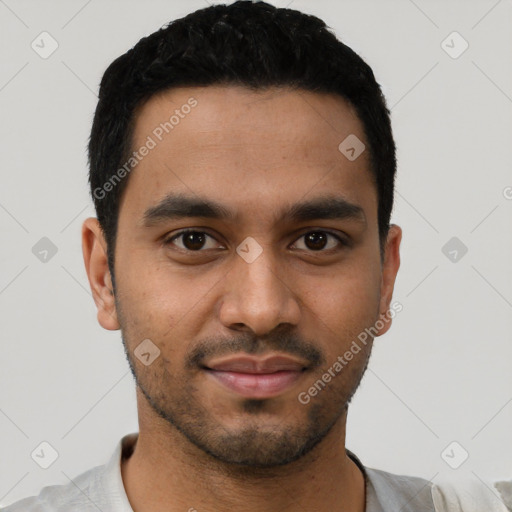 Joyful latino young-adult male with short  black hair and brown eyes
