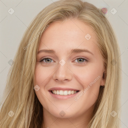 Joyful white young-adult female with long  brown hair and blue eyes