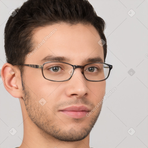 Neutral white young-adult male with short  brown hair and brown eyes