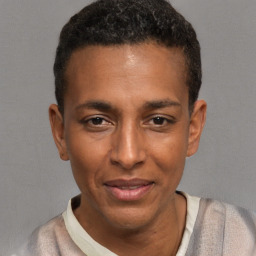 Joyful latino young-adult male with short  brown hair and brown eyes