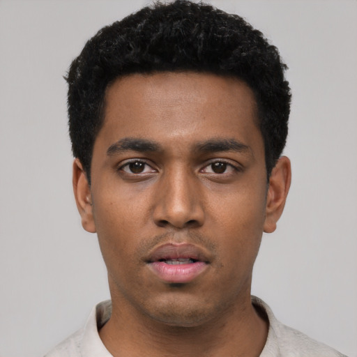 Neutral black young-adult male with short  black hair and brown eyes