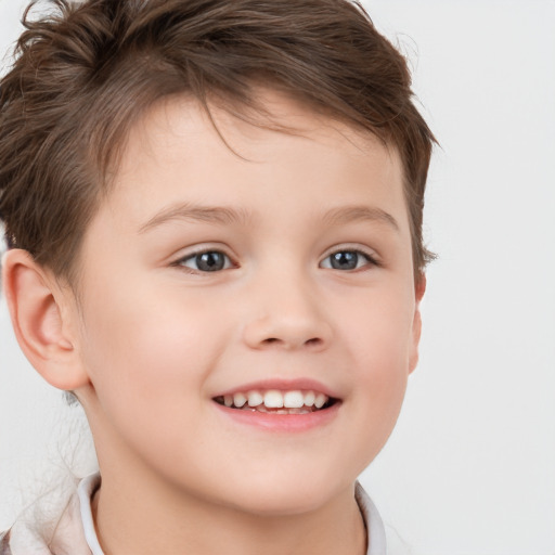 Joyful white child female with short  brown hair and brown eyes