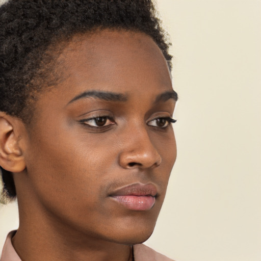 Neutral black young-adult female with short  brown hair and brown eyes