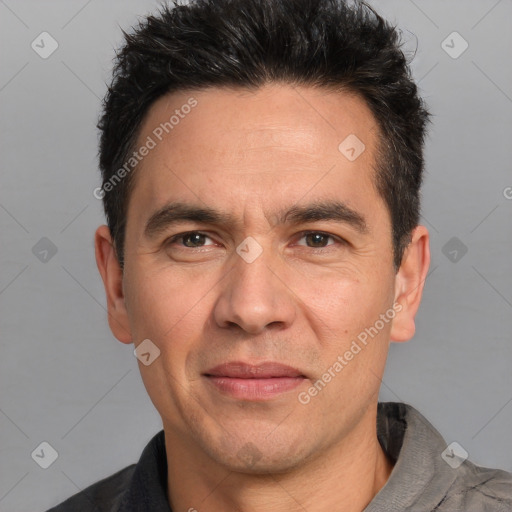 Joyful white adult male with short  black hair and brown eyes