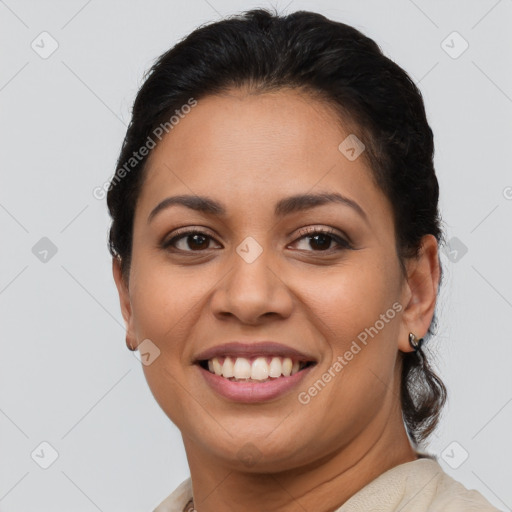 Joyful latino young-adult female with short  brown hair and brown eyes